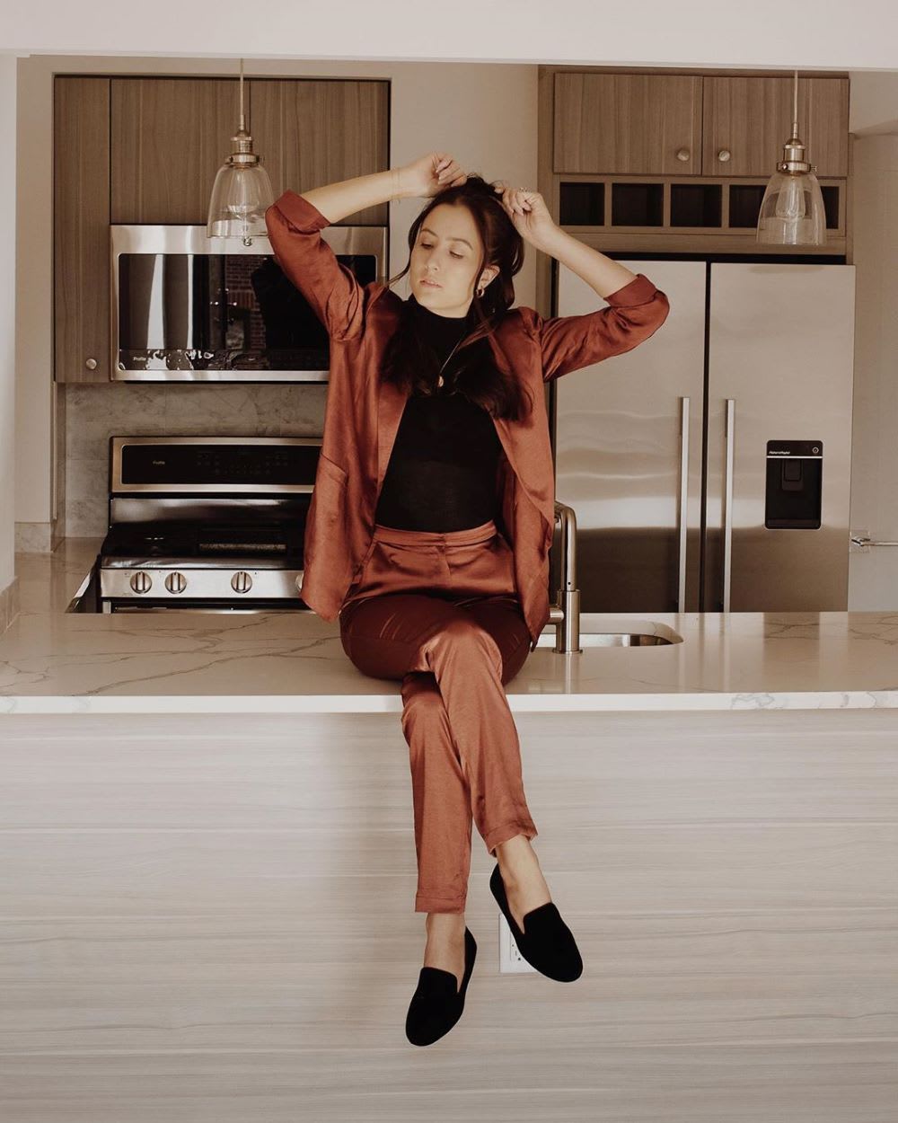 woman wearing a suit for virtual interview at home