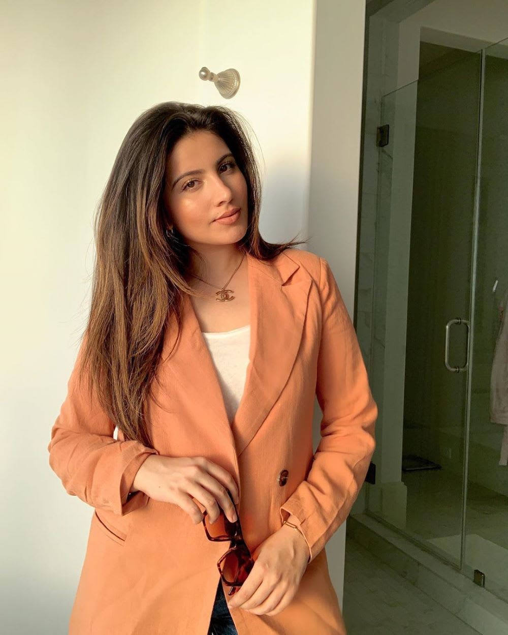 woman wearing a rust blazer