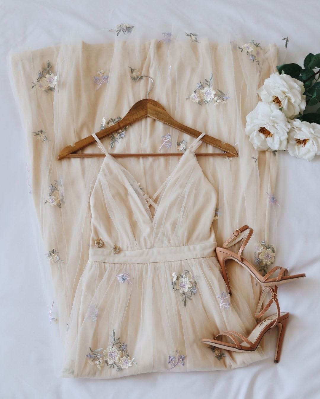 embroidered blush dress and heels for bride