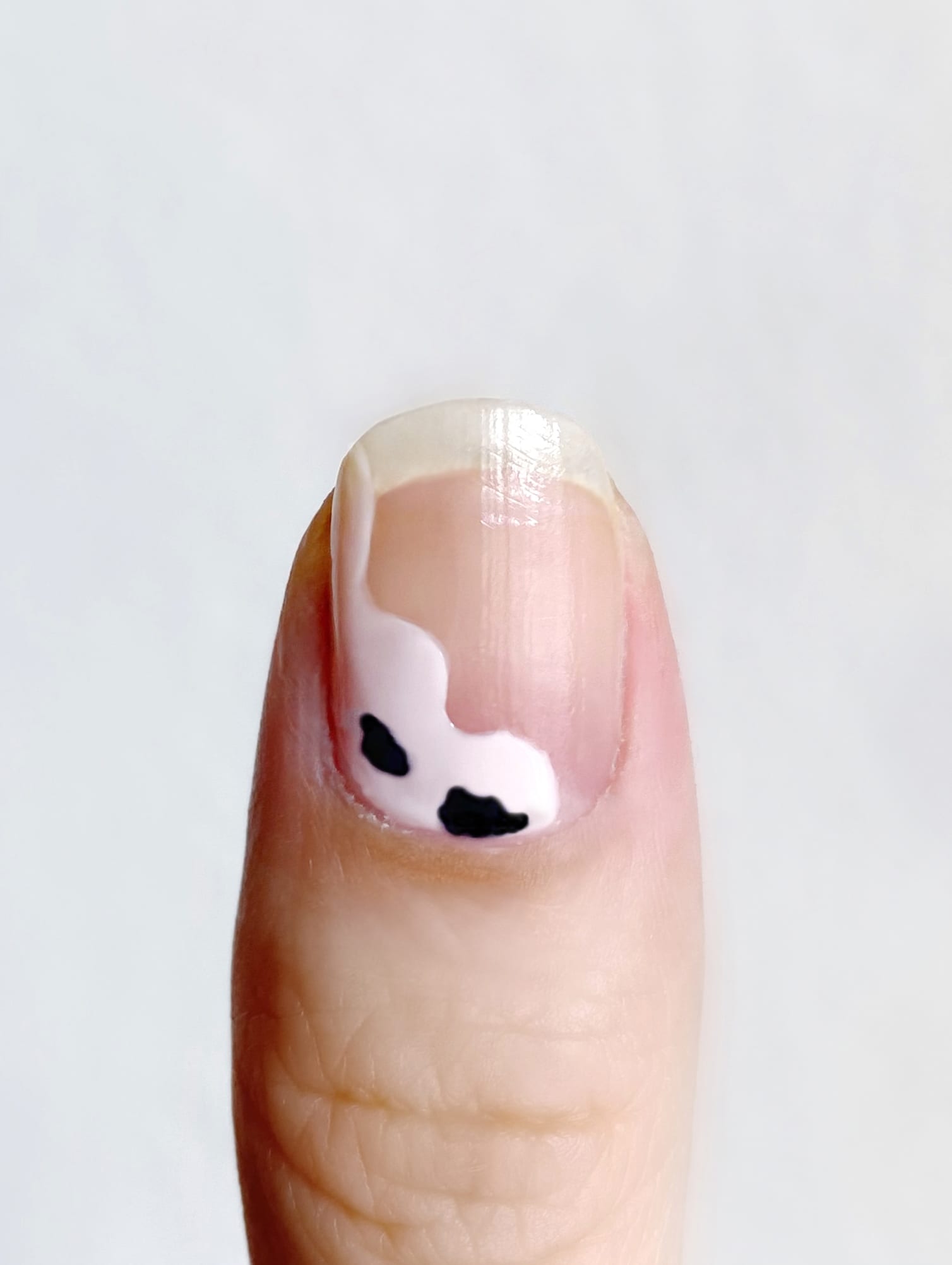 step 2 adding black on negative space cow nails