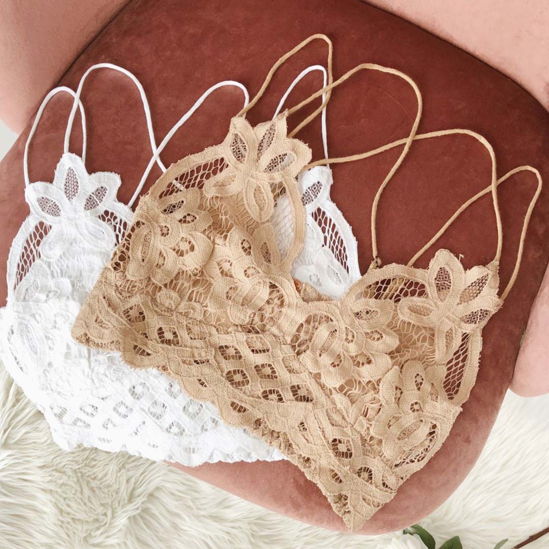 free people lace bralettes on a table with flowers