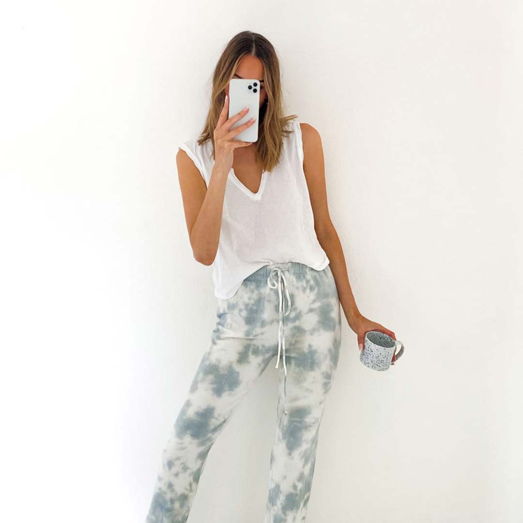 woman in tank and tie dye joggers