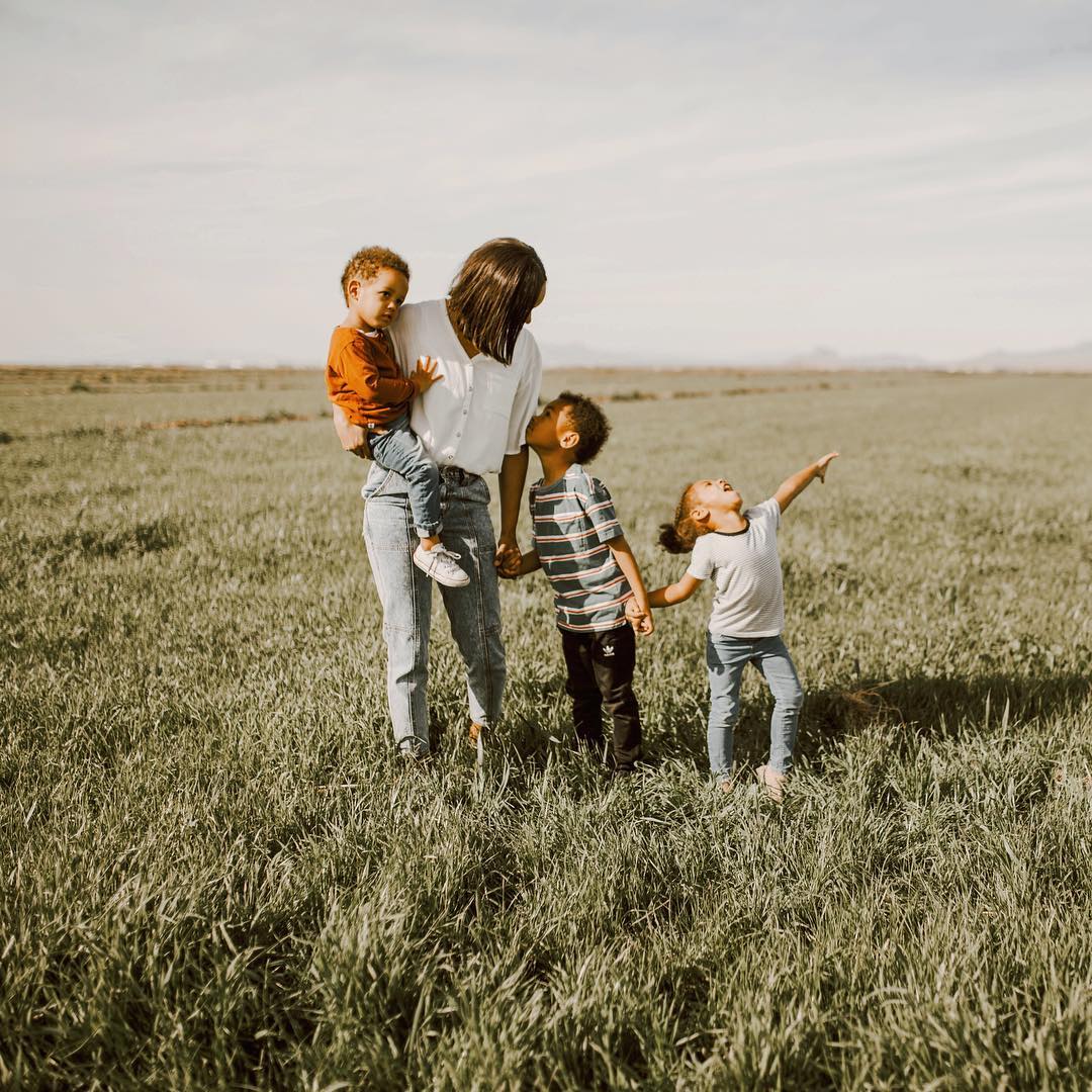 woman outside with her three kids who may head to homeschool classroom in 2020
