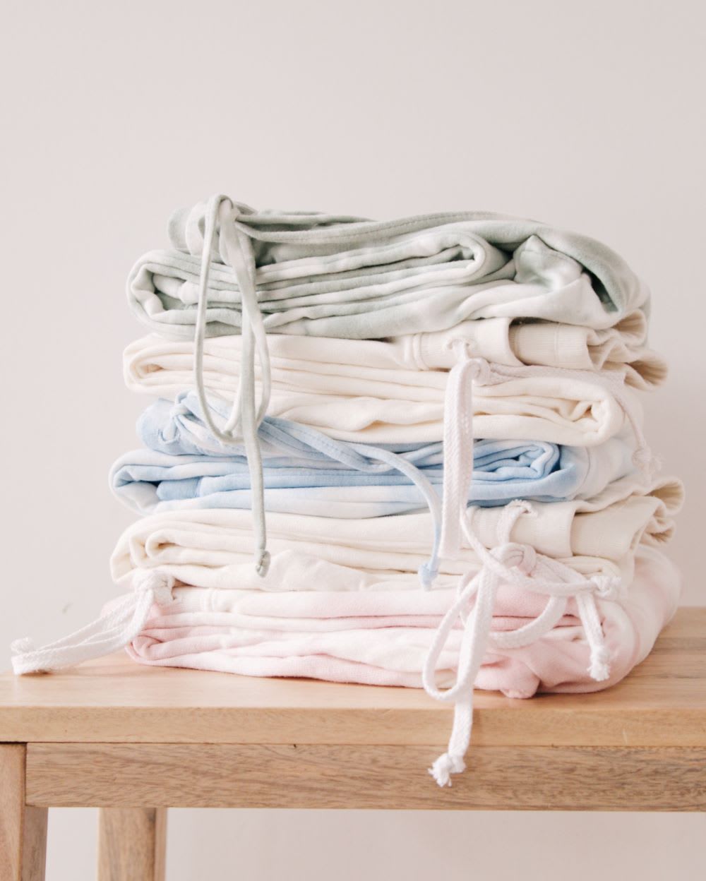 loungewear pants in a pile