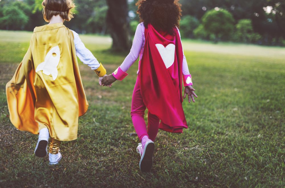black and white little girls holding hands