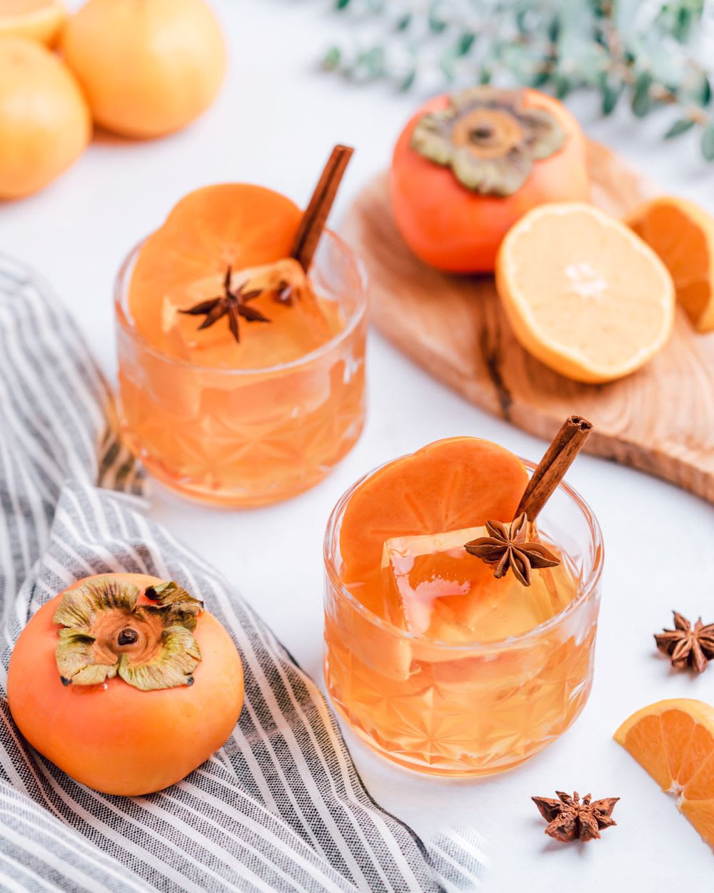 persimmon citrus old fashioned holiday cocktail recipe in glasses