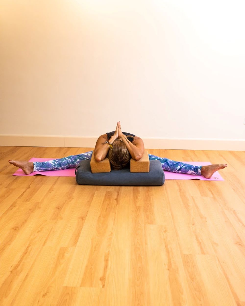 wide leg restorative yoga pose for stress relief