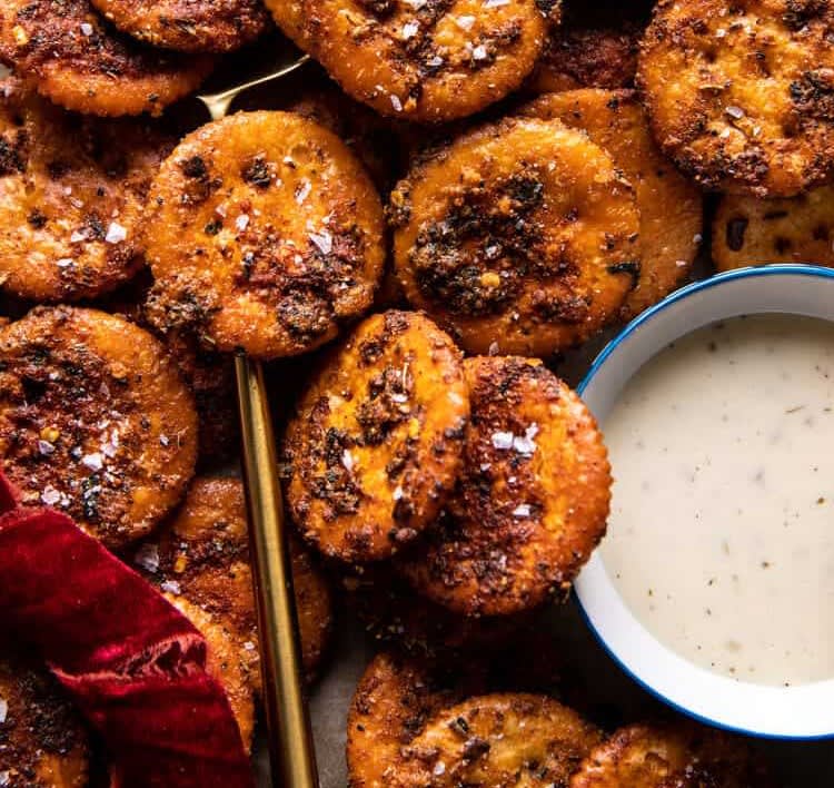a closeup shot of spicy crackers new year's appetizers with dip sauce