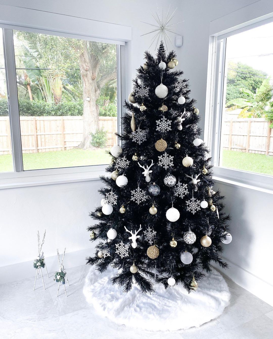 black christmas tree with gold and silver ornaments