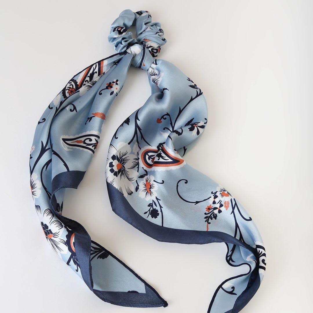 a blue multi print scarf ponytail holder
