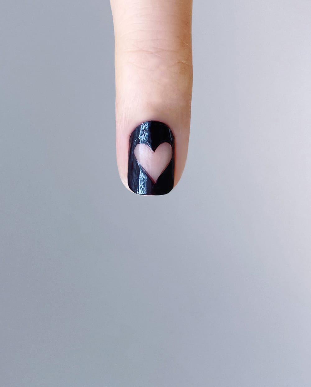 negative space heart on nail with black polish