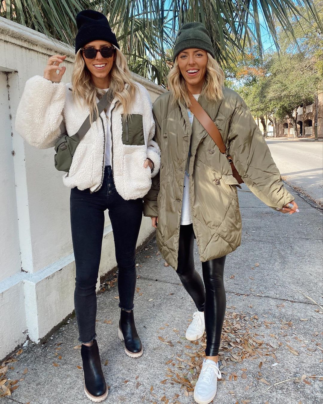 women walking outdoors wearing cozy winter jackets and leggings with sneakers and knit beanies