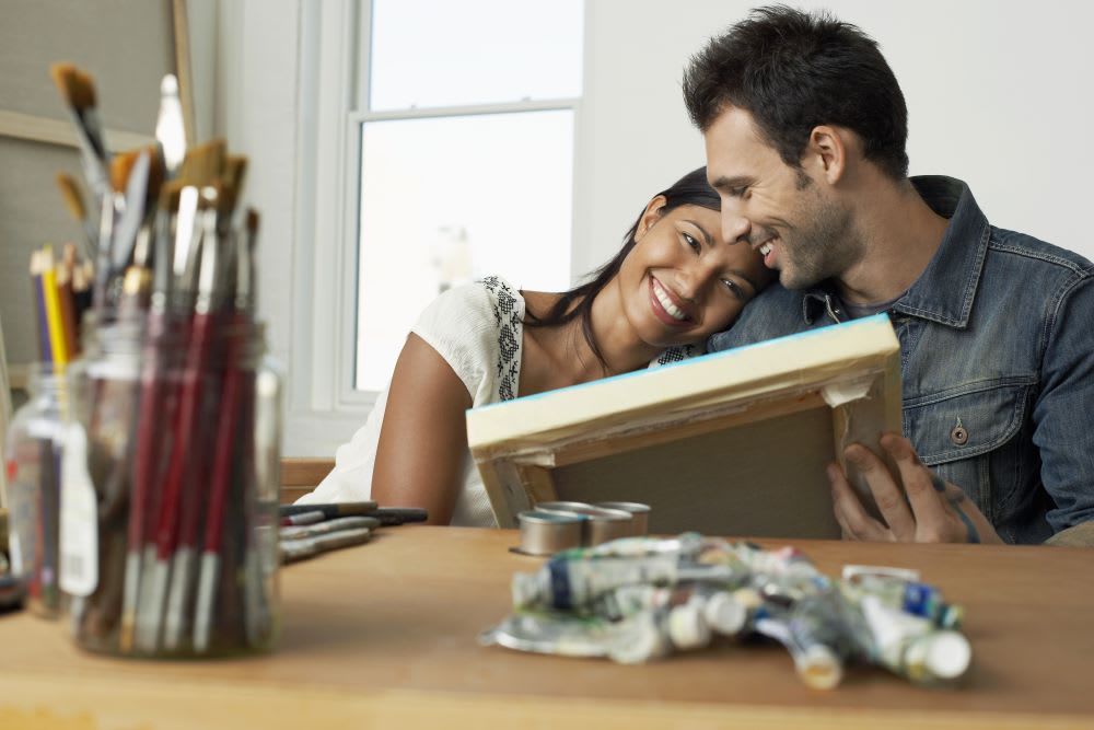 a couple painting together for date night at home