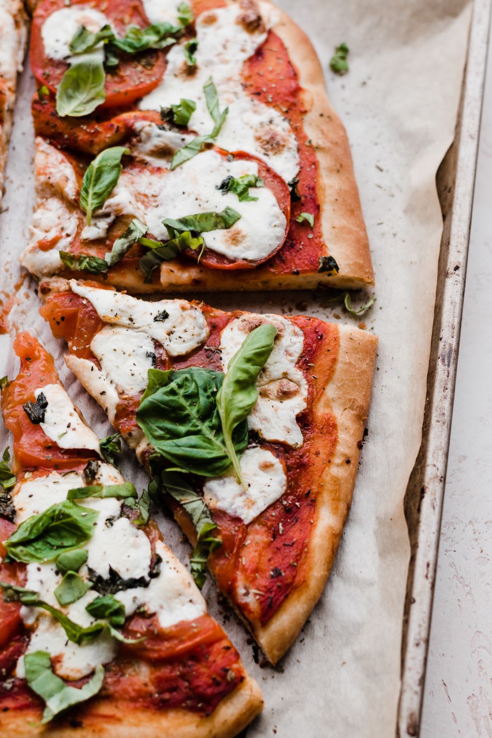 slices of margherita pizza on a tray made at home