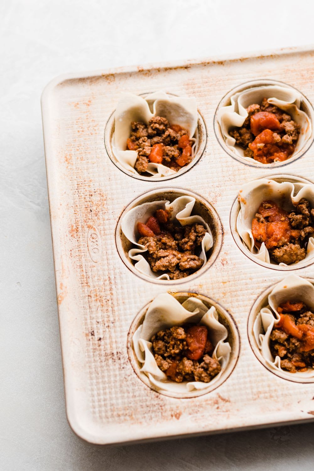 ingredients for taco cups wonton appetizer in muffin tin