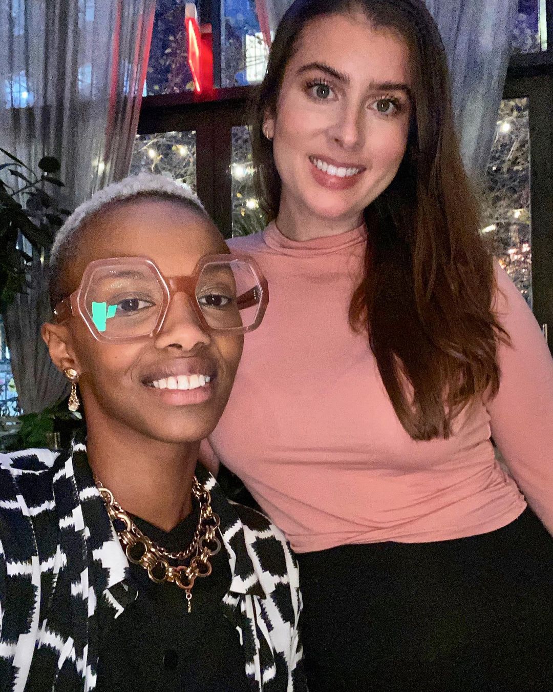 two smiling kinswomen podcasters on the importance of race conversations and black history