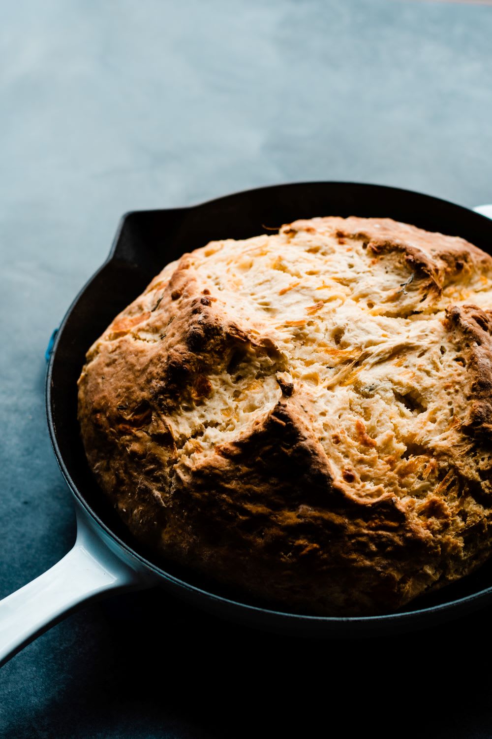 cheddar herb irish soda bread in a pan fresh from the oven