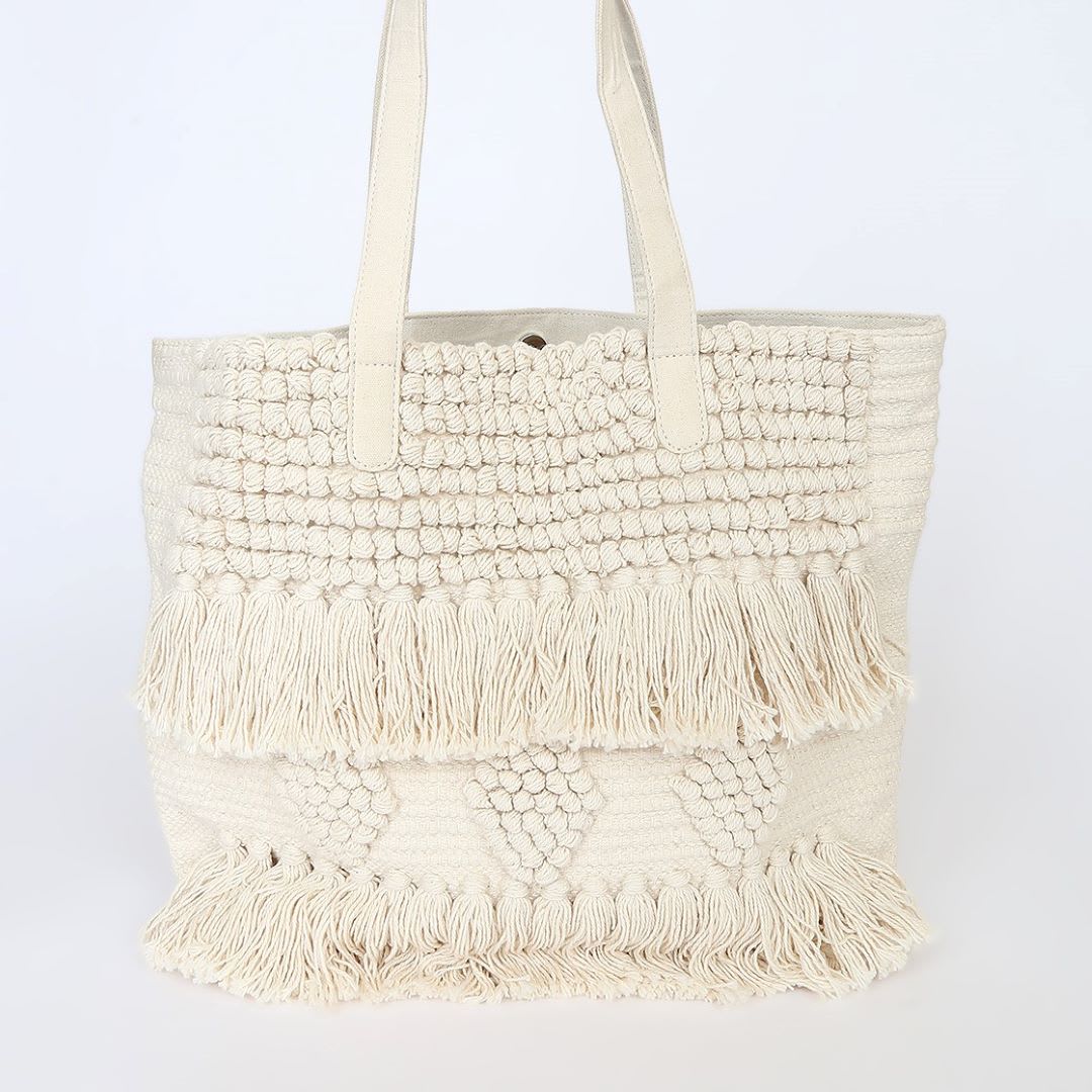 cream woven beach bag with fringe