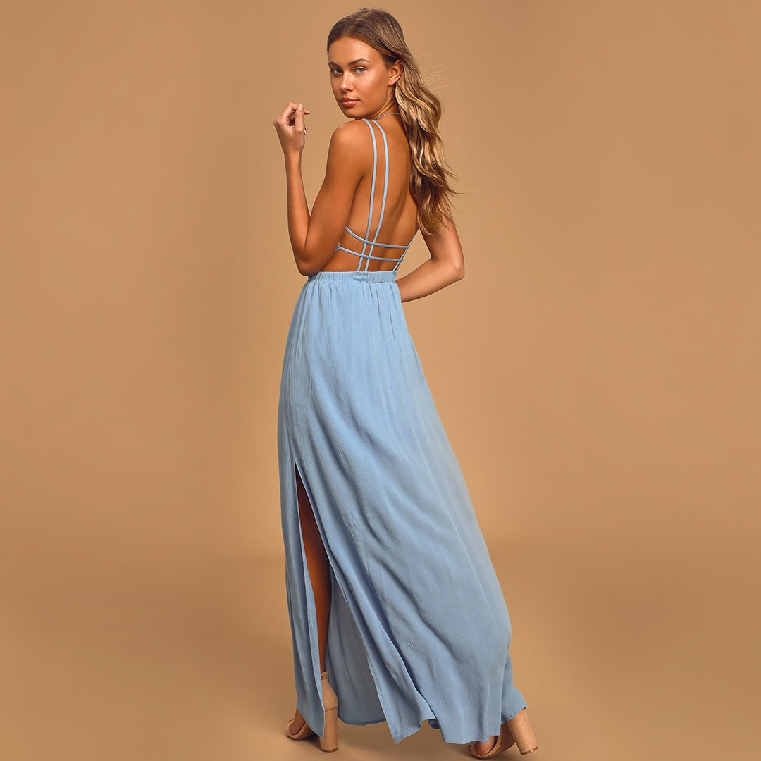Back view of a model wearing a strappy slate blue maxi dress