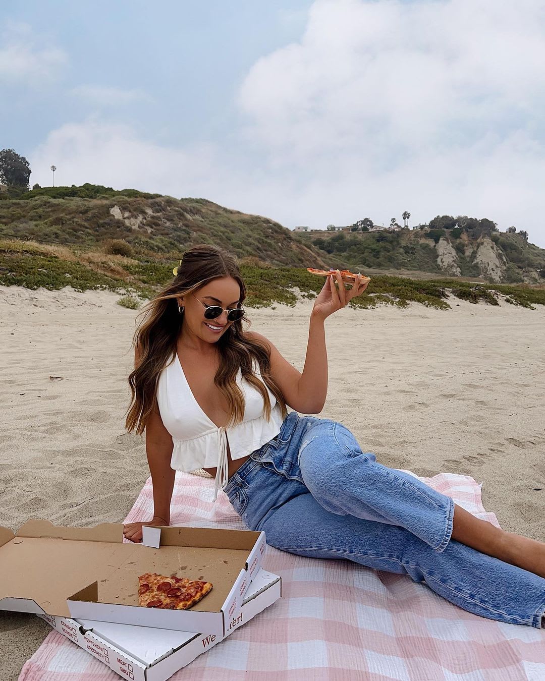 ivory sleeveless ruffled tie front top