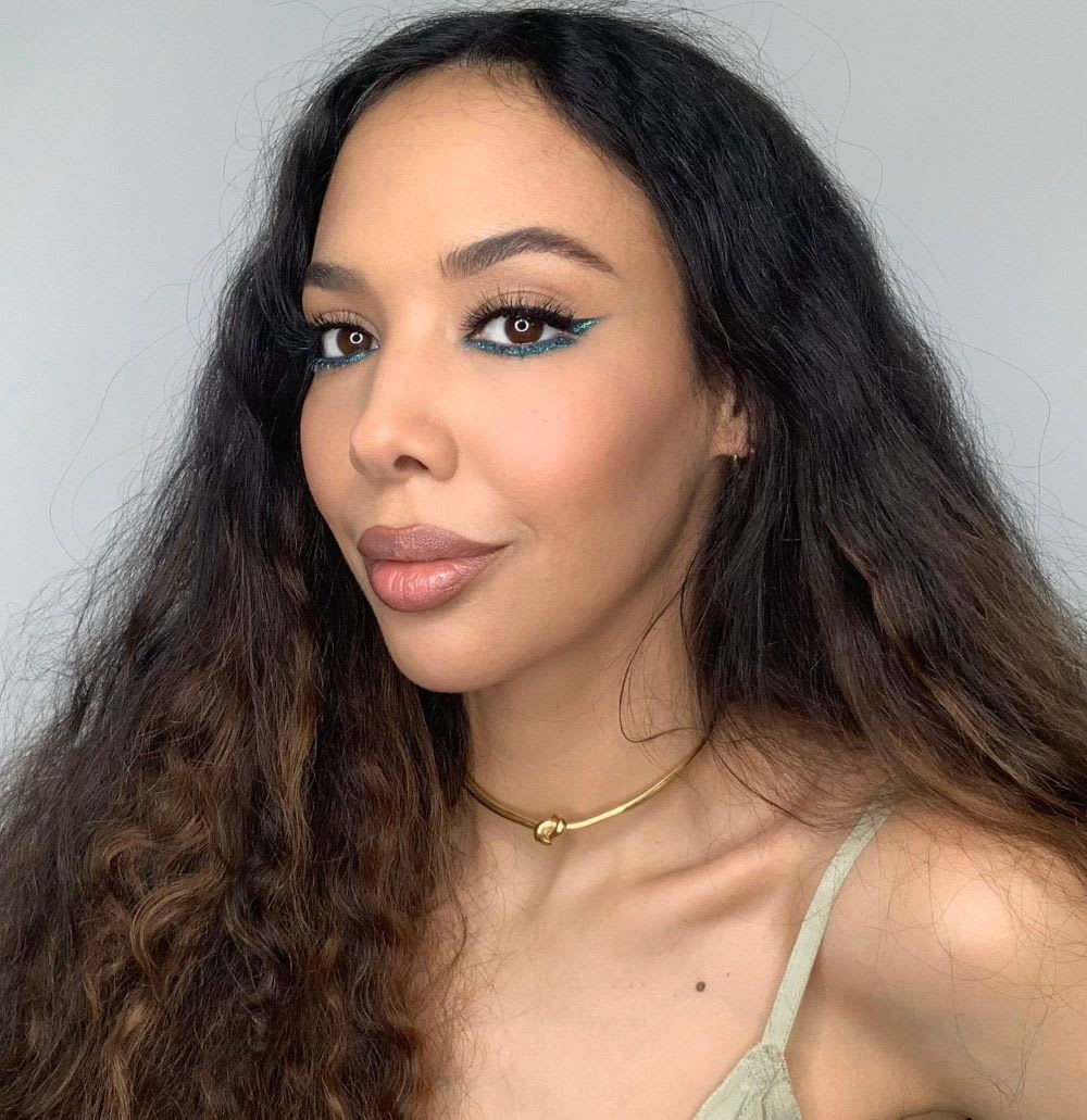 a woman wearing bold colored eyeliner