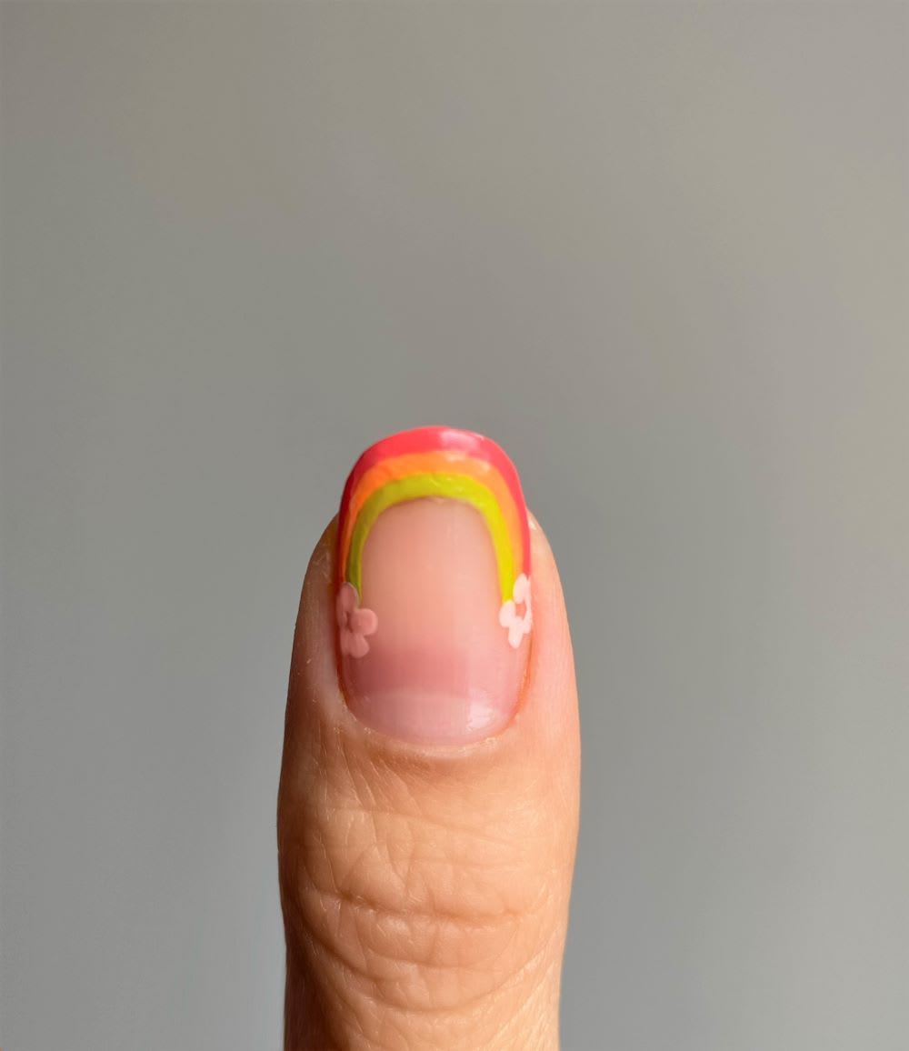 step 4 of rainbow nails tutorial with flower pets added