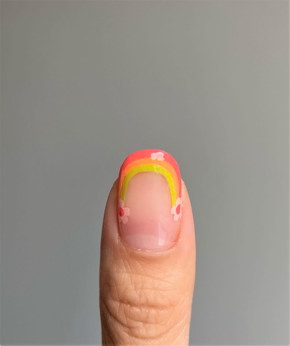 final step of rainbow design on nail tip
