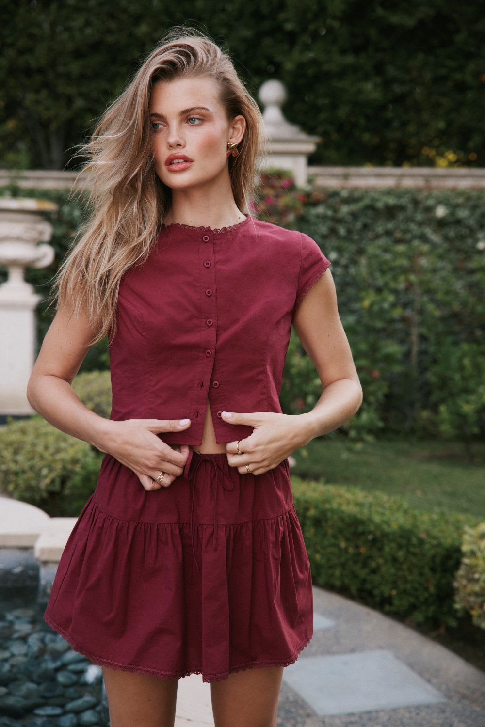 burgundy top and mini skirt