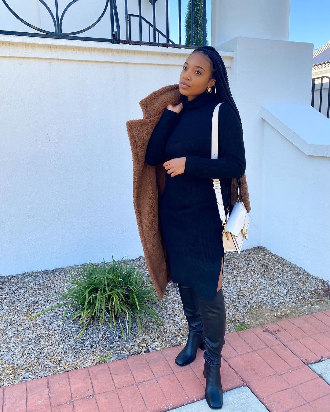 black sweater dress and boots