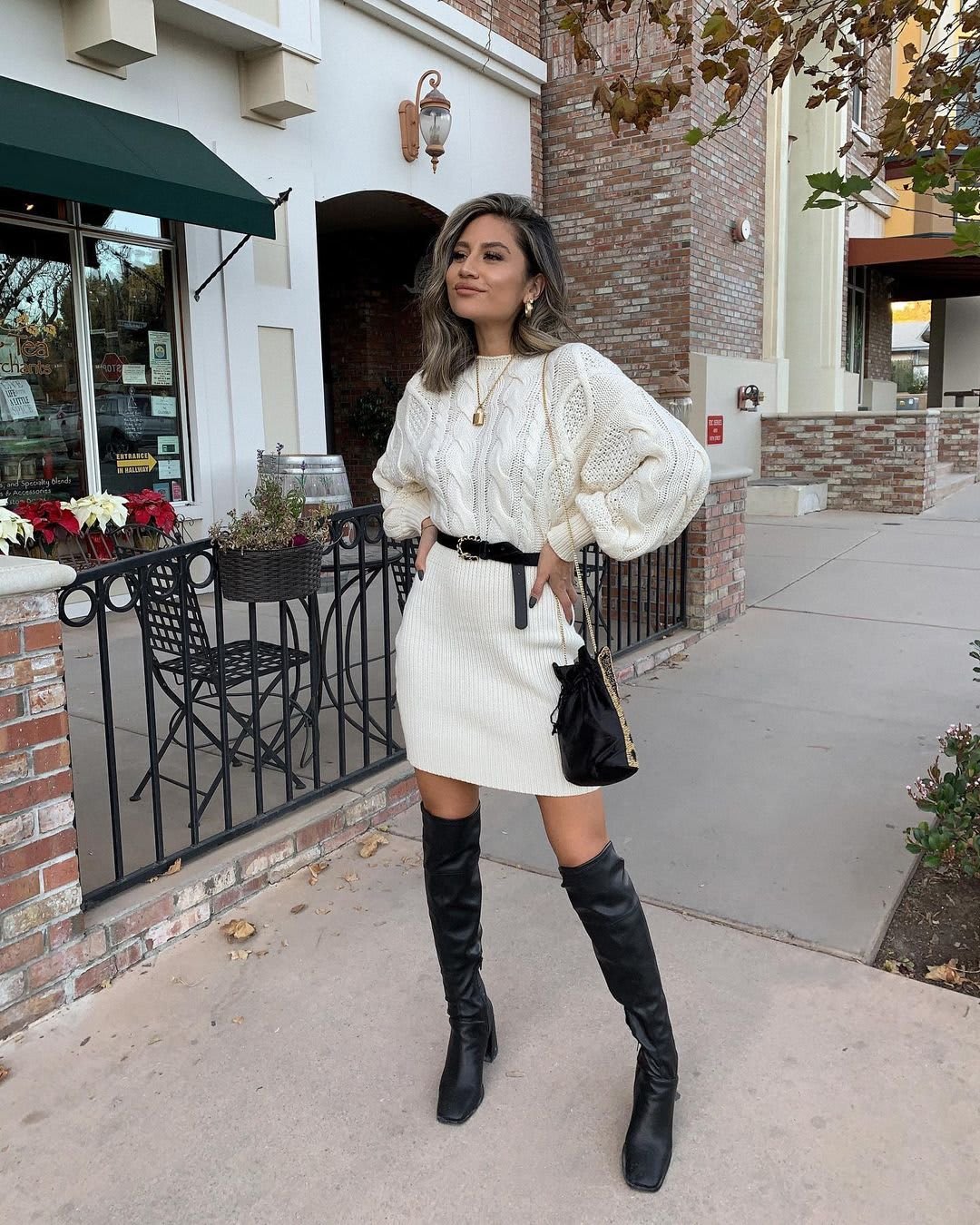 white sweater dress with black boots`