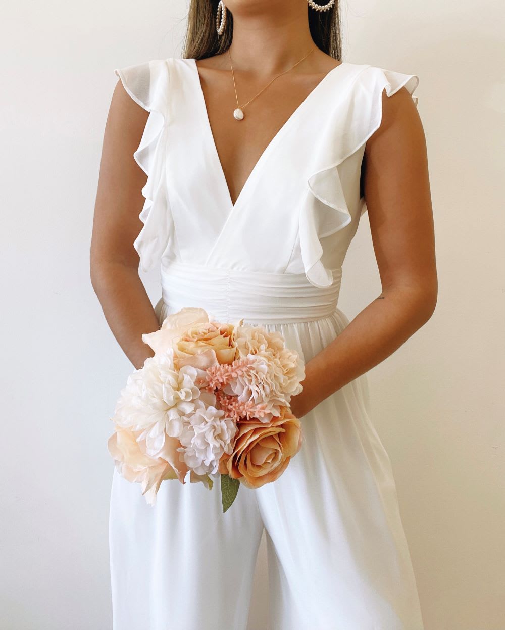 white ruffled wide leg jumpsuit