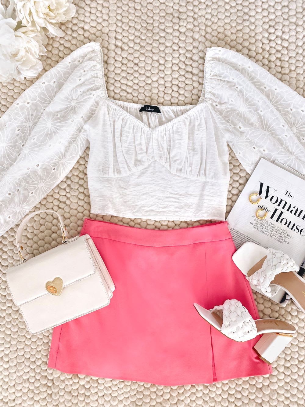 white embroidered crop top and bright pink skort