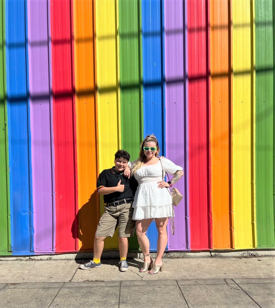 mom and trans child with pride rainbow
