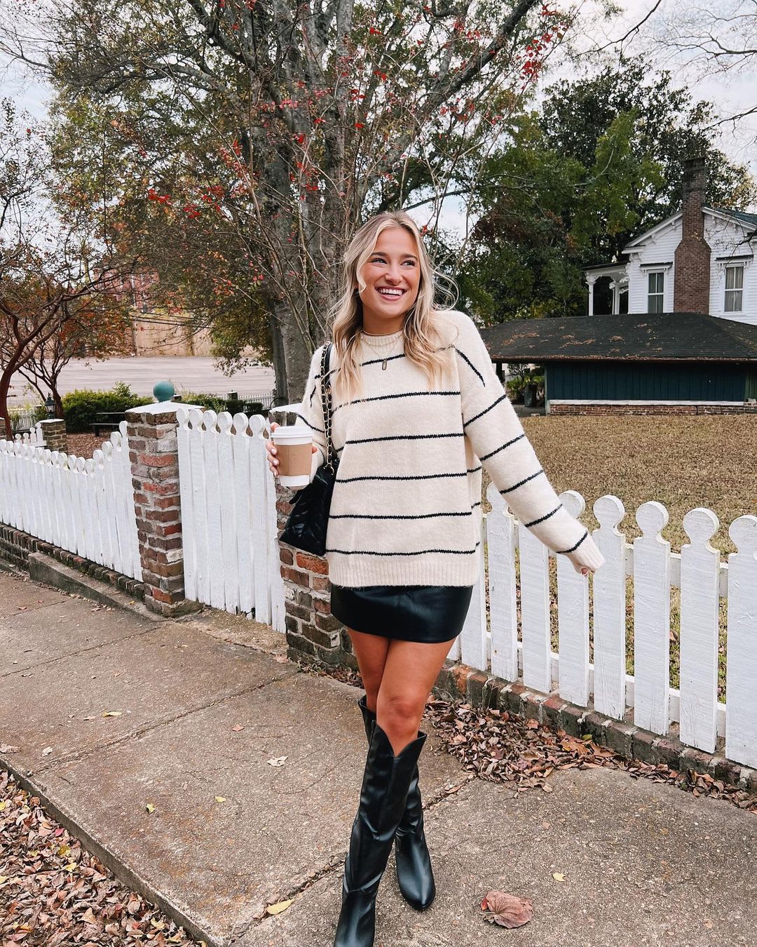 striped sweater and leather skirt