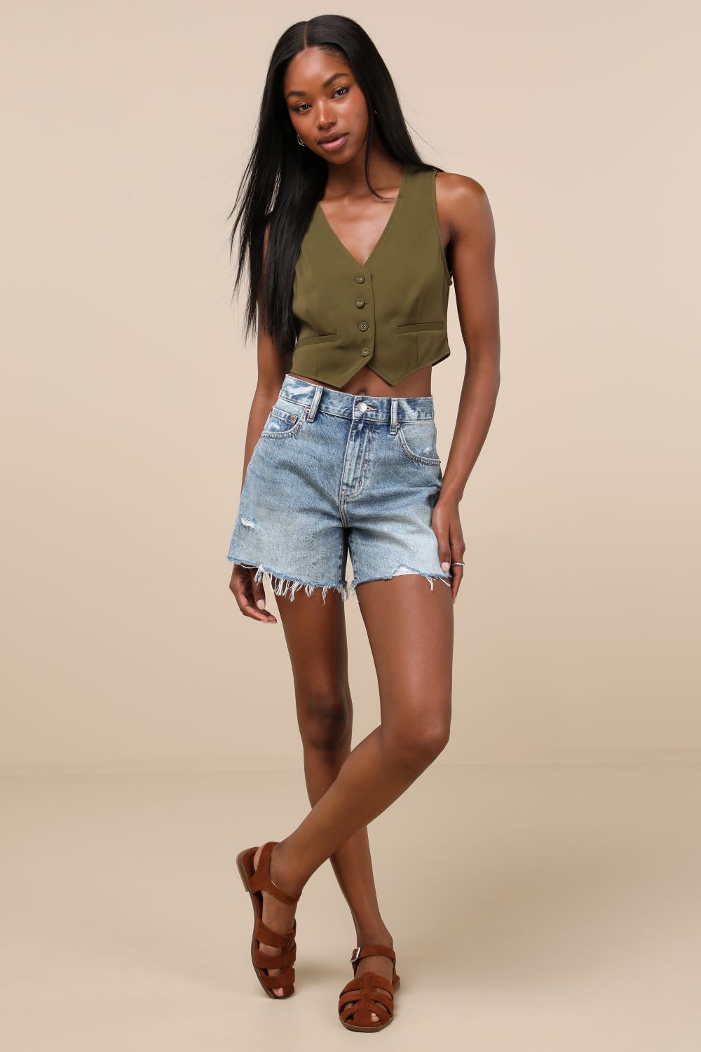 vest and cutoff shorts
