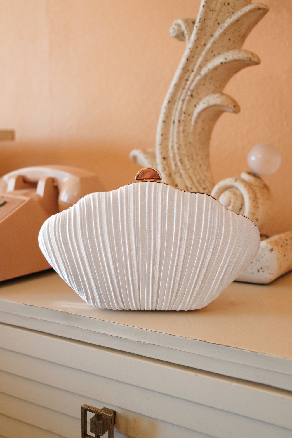satin seashell clutch