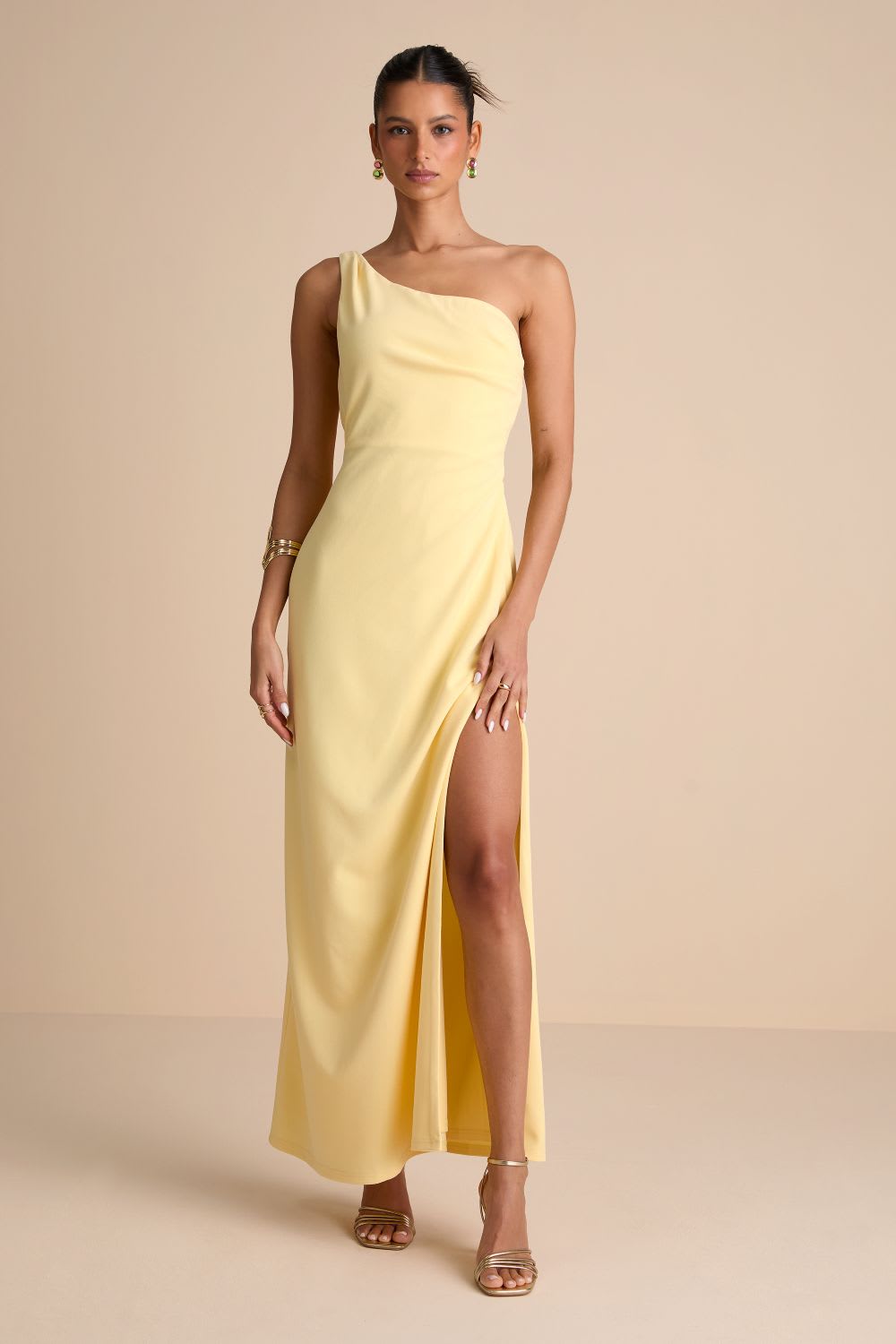 butter yellow dress with gold accessories
