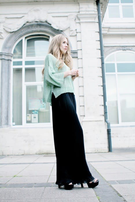 Make a maxi skirt work for winter by wearing it with a cropped sweater and  ankle boots on Stylevore