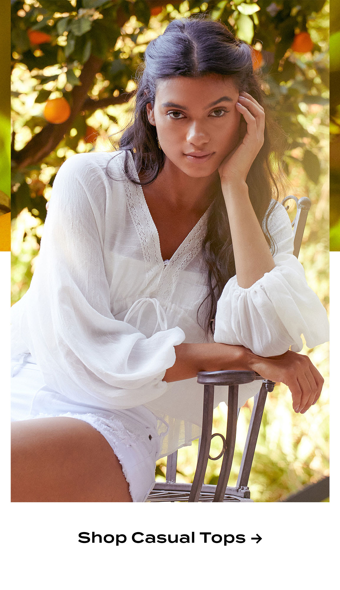 Model wearing white dolman sleeve top