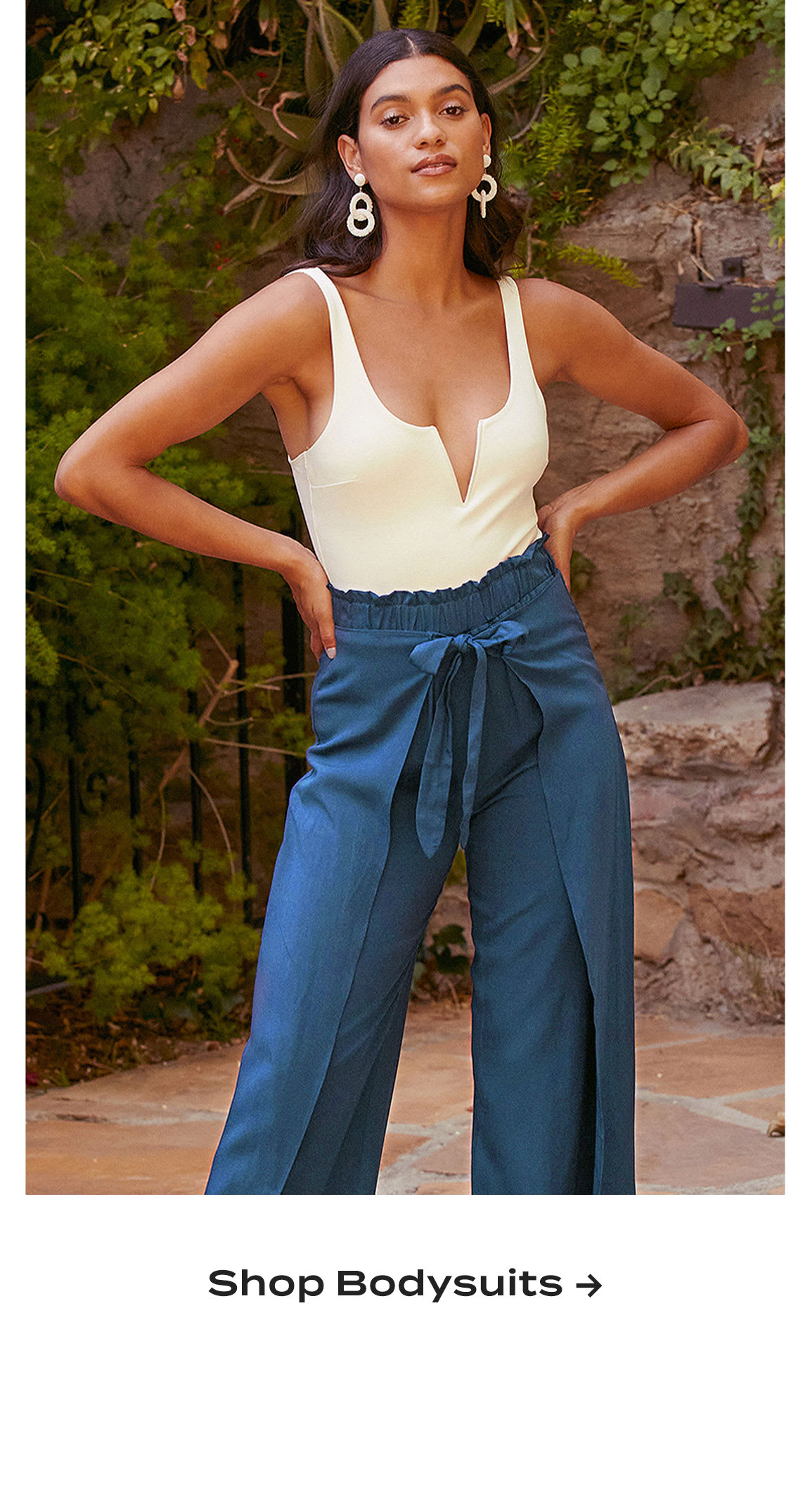 Model wearing white sleeveless bodysuit