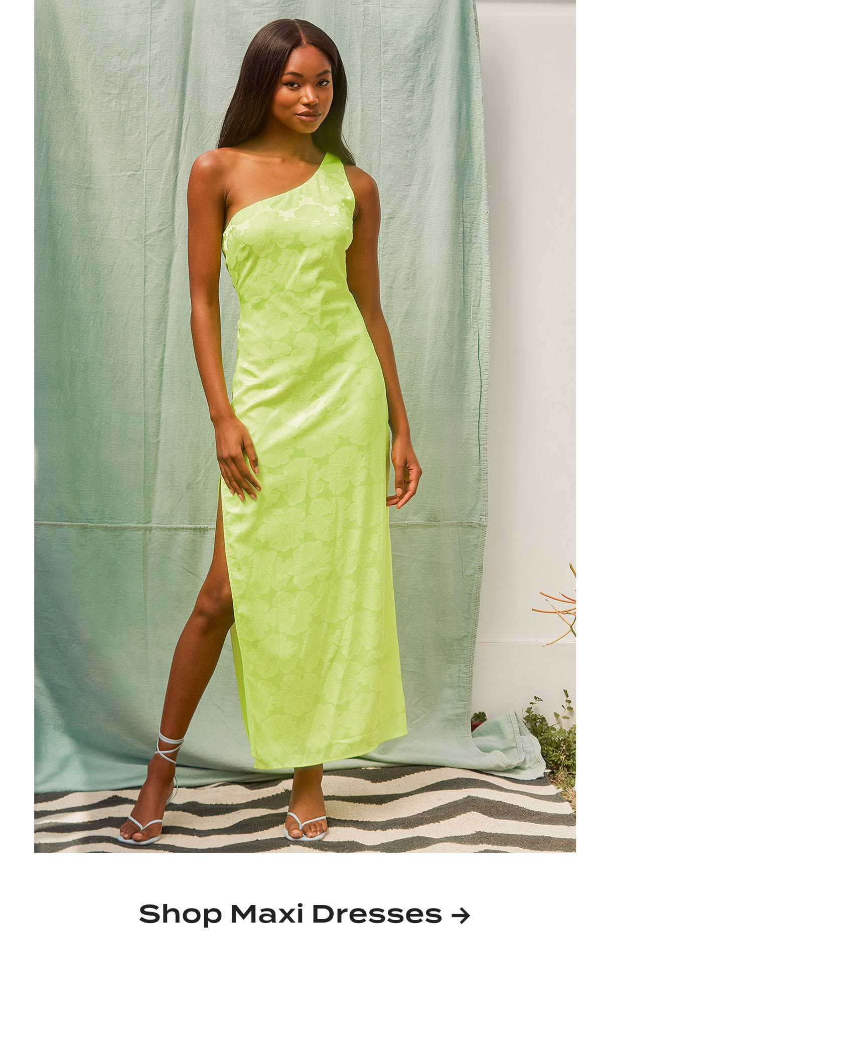 Model wearing yellow satin one-shoulder maxi dress