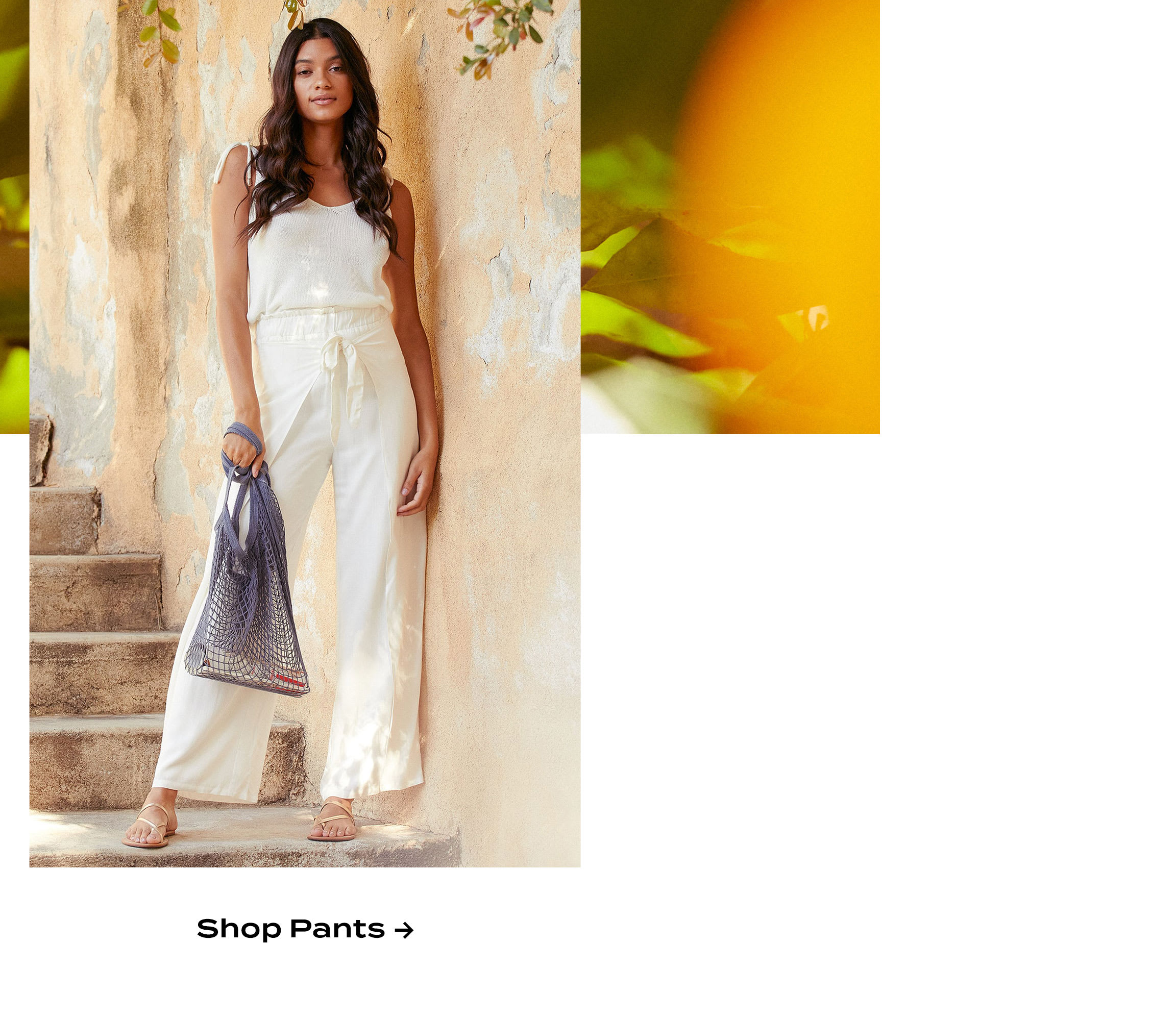 Model wearing white tie-front wide-leg pants