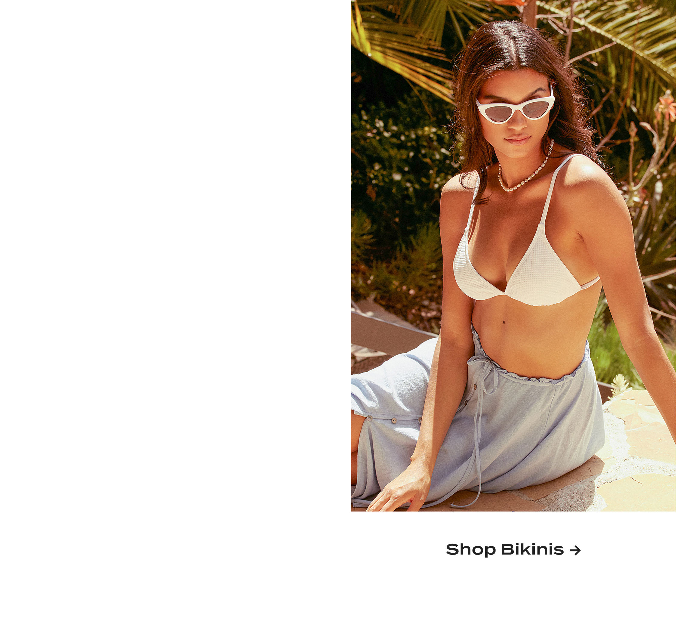 Model wearing white triangle bikini top