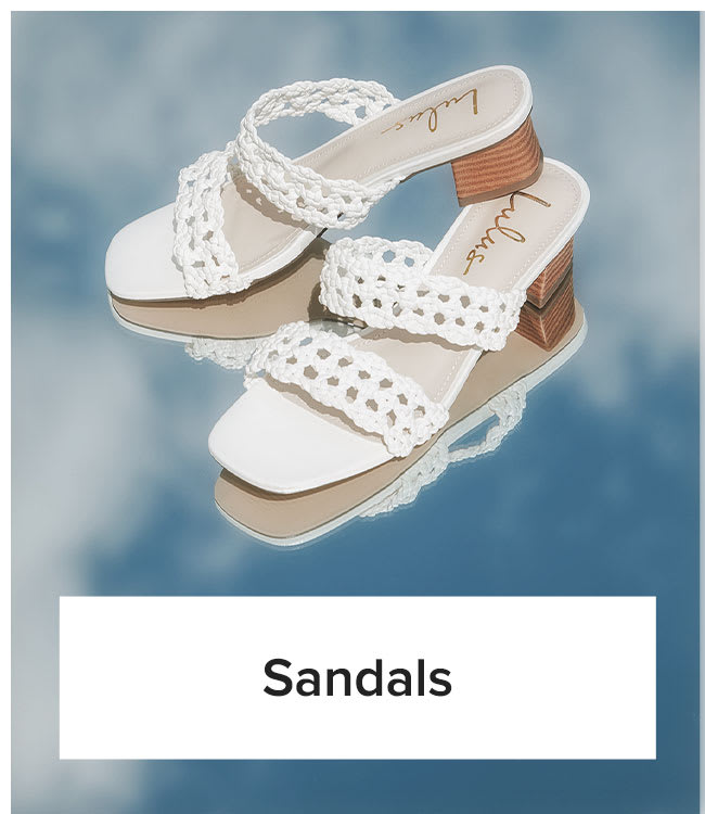 Sandals | Closeup shot of white woven heeled slip-on sandals