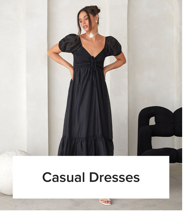Casual Dresses | Model in black smocked puff sleeve midi dress