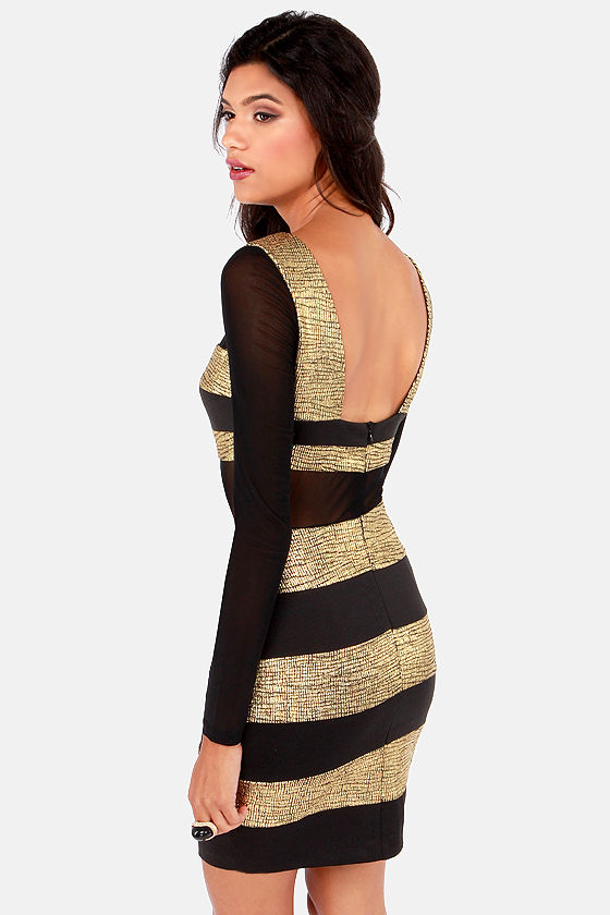 black dress with gold stripes Hanna Andersson Black velour dress with gold shimmery stripes & ruffles. Size 4T main image 1