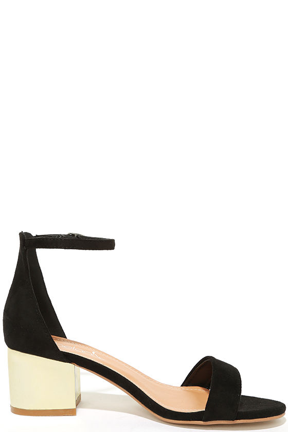 black high heels with gold ankle strap