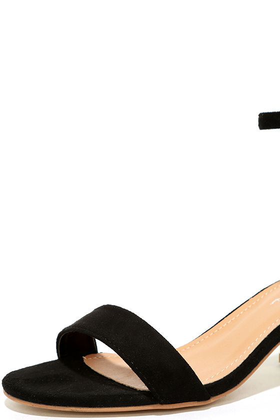 black high heels with gold ankle strap