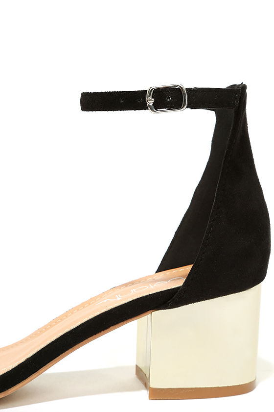 black high heels with gold ankle strap