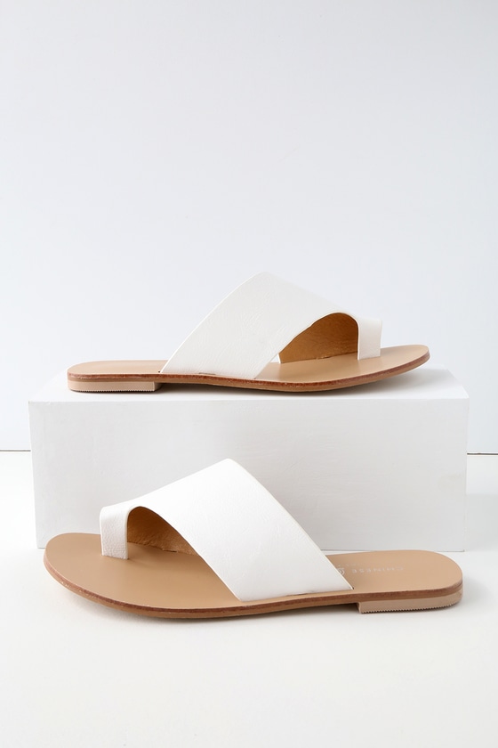 white flat mule slides